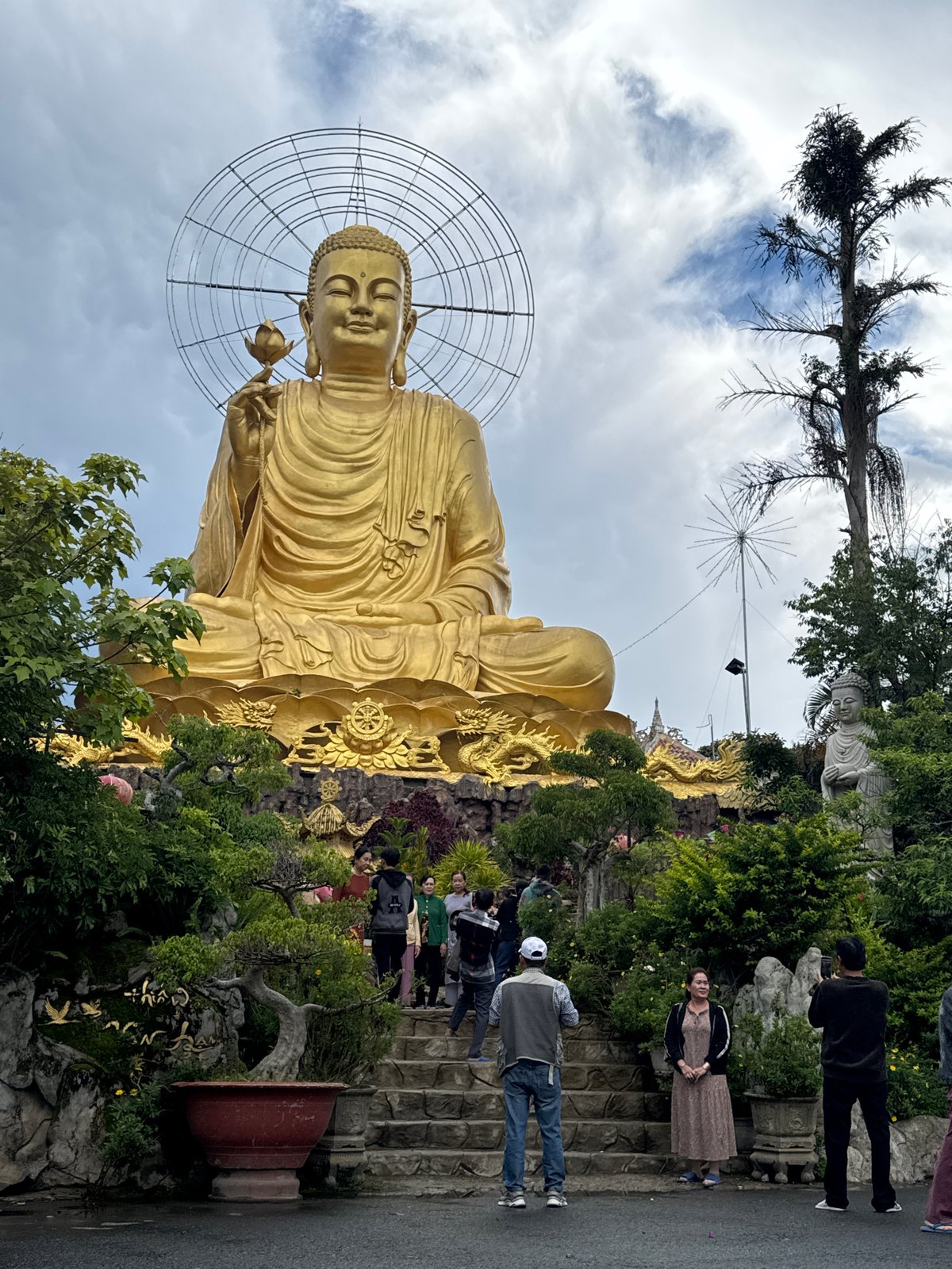 Golden Buddha statue draws visitors in Đà Lạt Vietnam