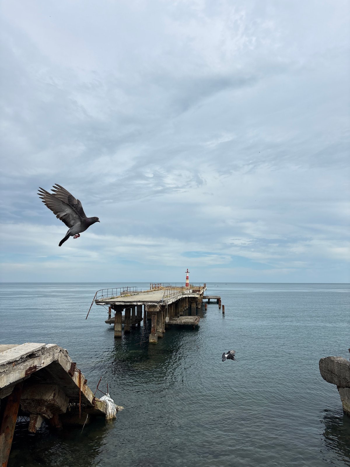 Ordinary afternoon captured along Alushta's waterfront under overcast skies