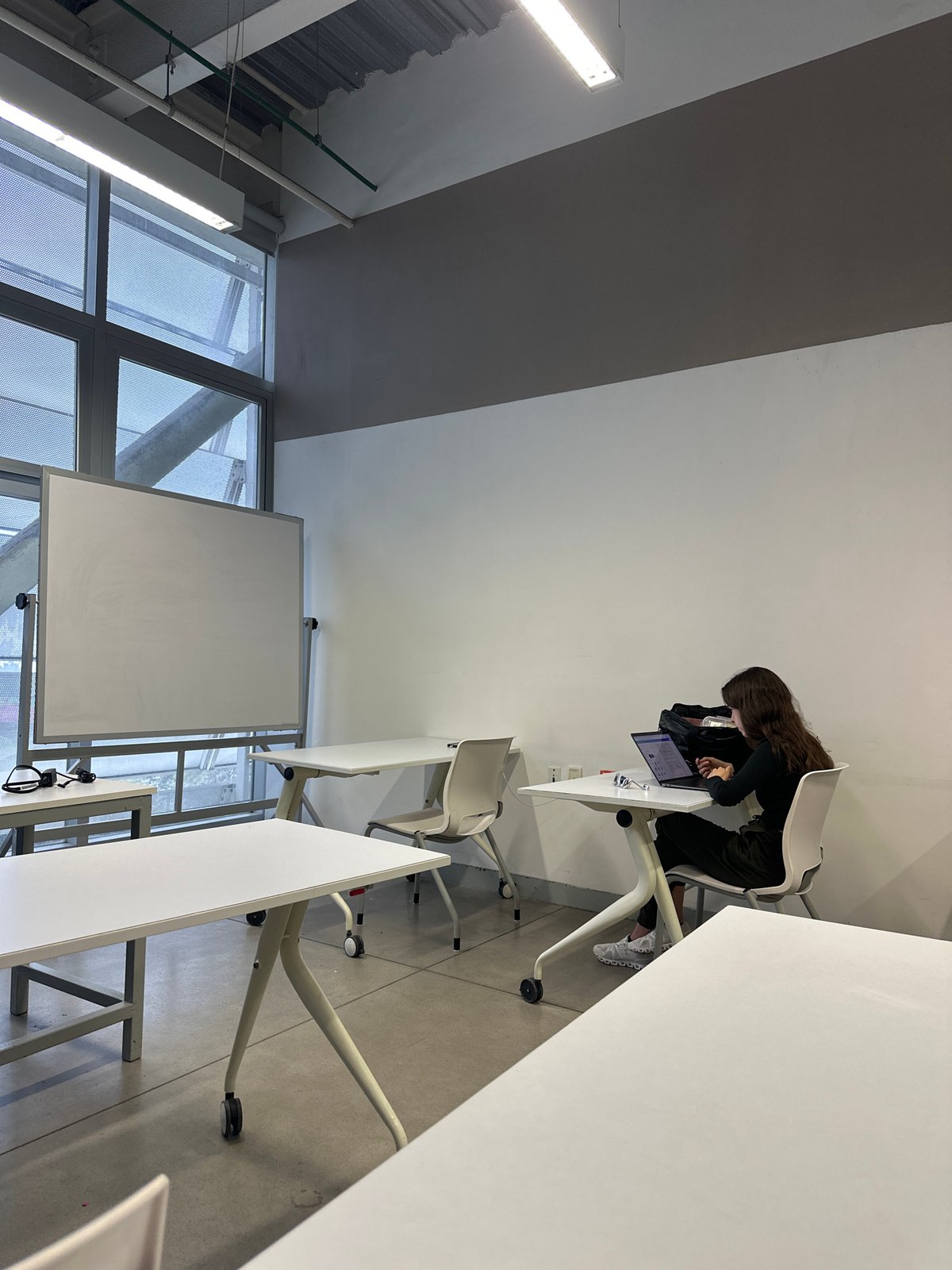 Woman works late at laptop in Mexico City office