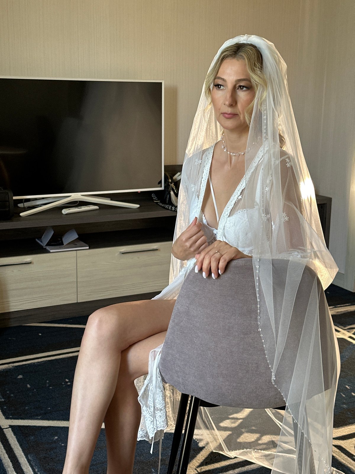 Bridal details: wedding dress and glittery heels in Novosibirsk