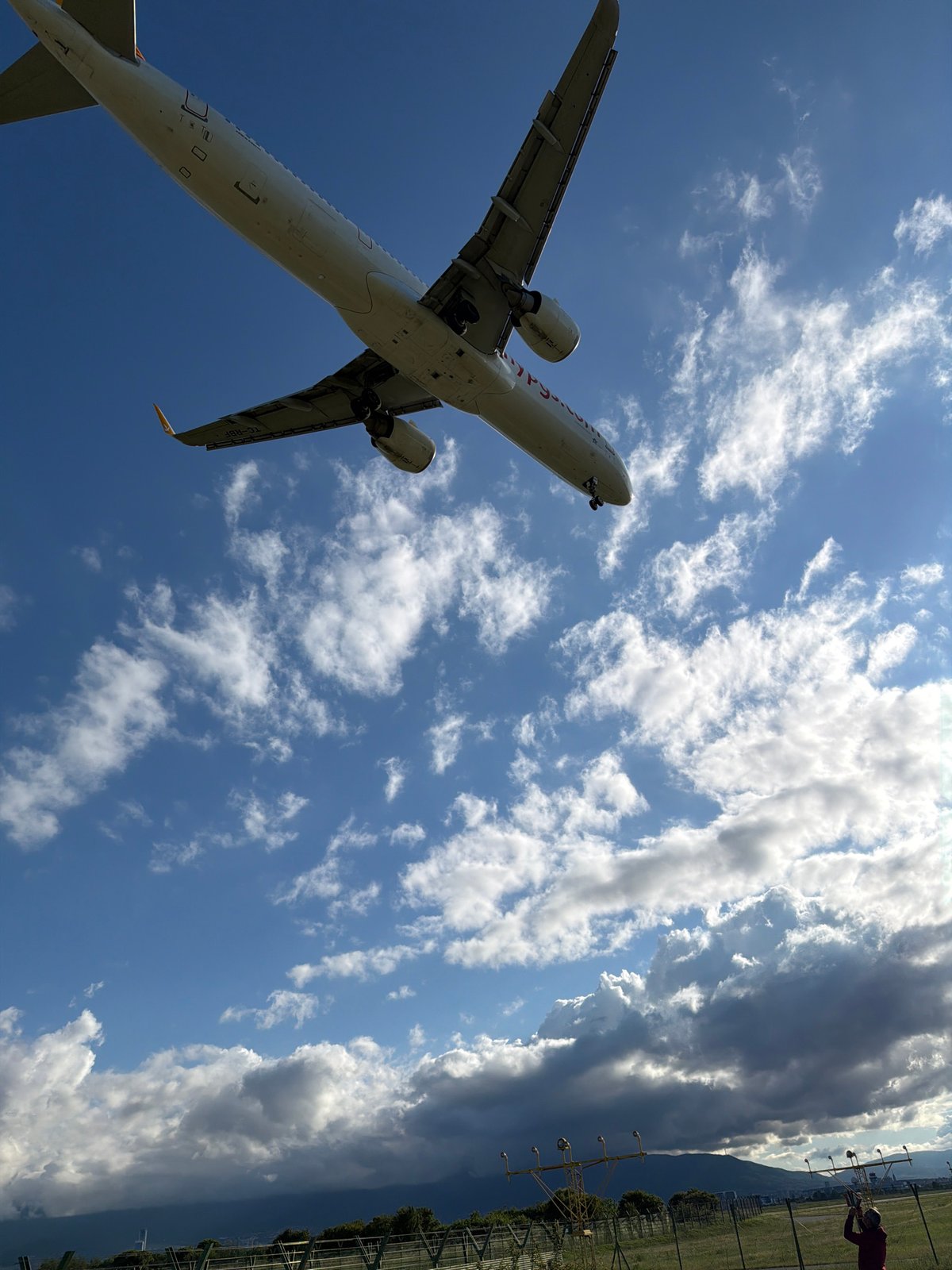 Commercial jet approaches Sofia Airport with landing gear deployed