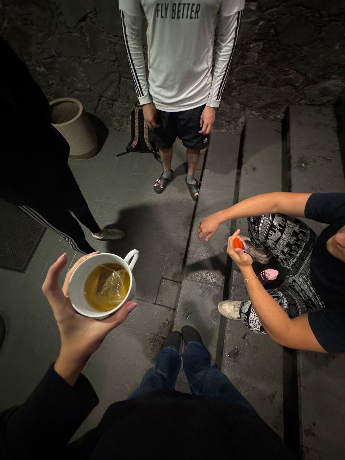 Late-night social gathering documented on Mexico City steps