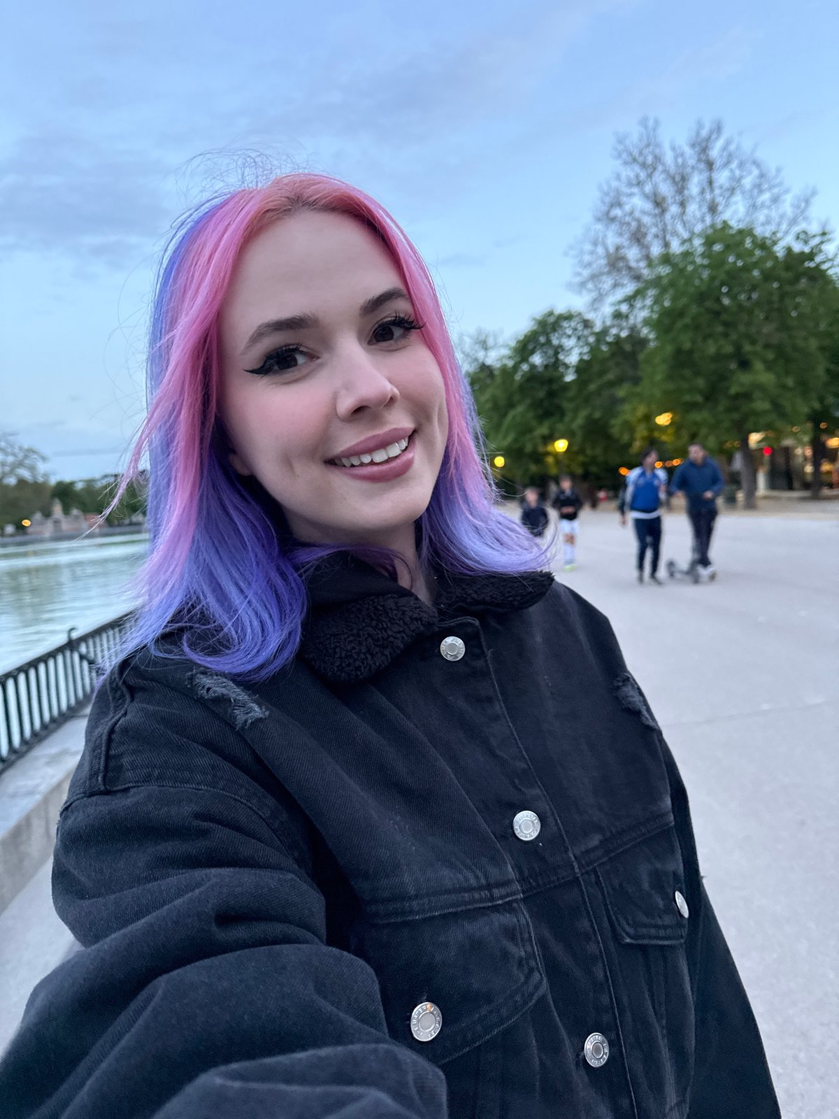 Woman poses for photos at Madrid's El Retiro Park