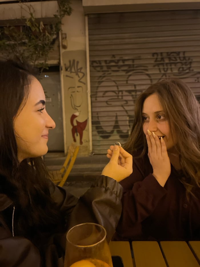 Marriage proposal celebration captured across Tel Aviv evening