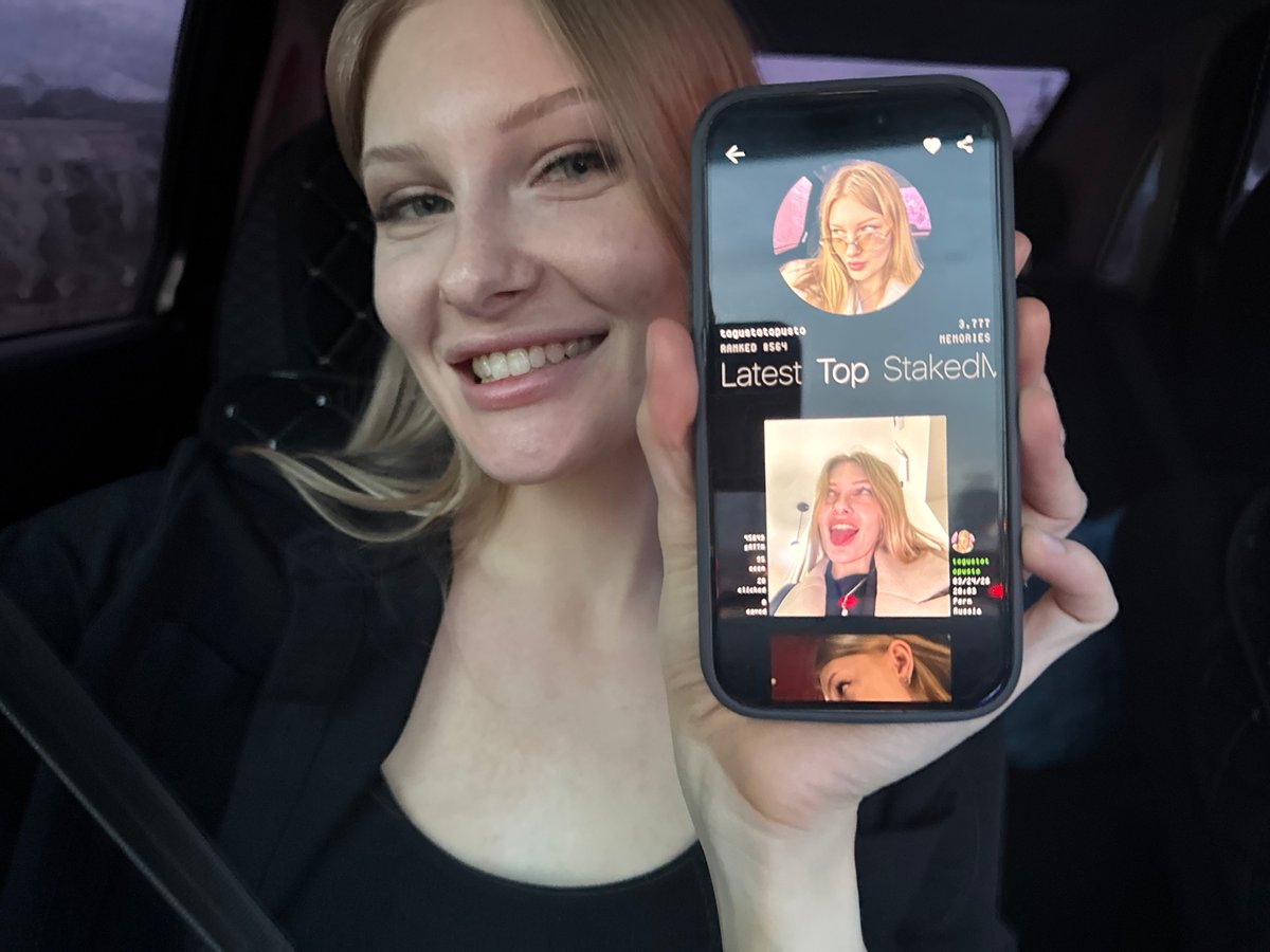 Woman reviews social media profile in car in Perm