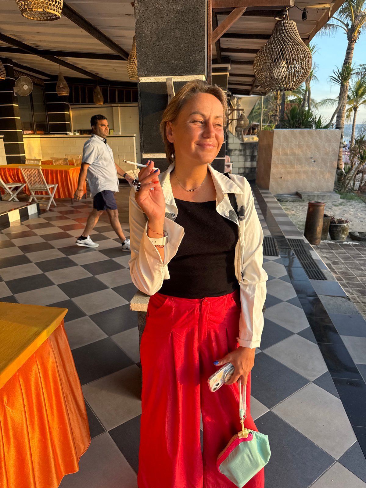 Sunset dining scene captured at Kuta Beach restaurant tables