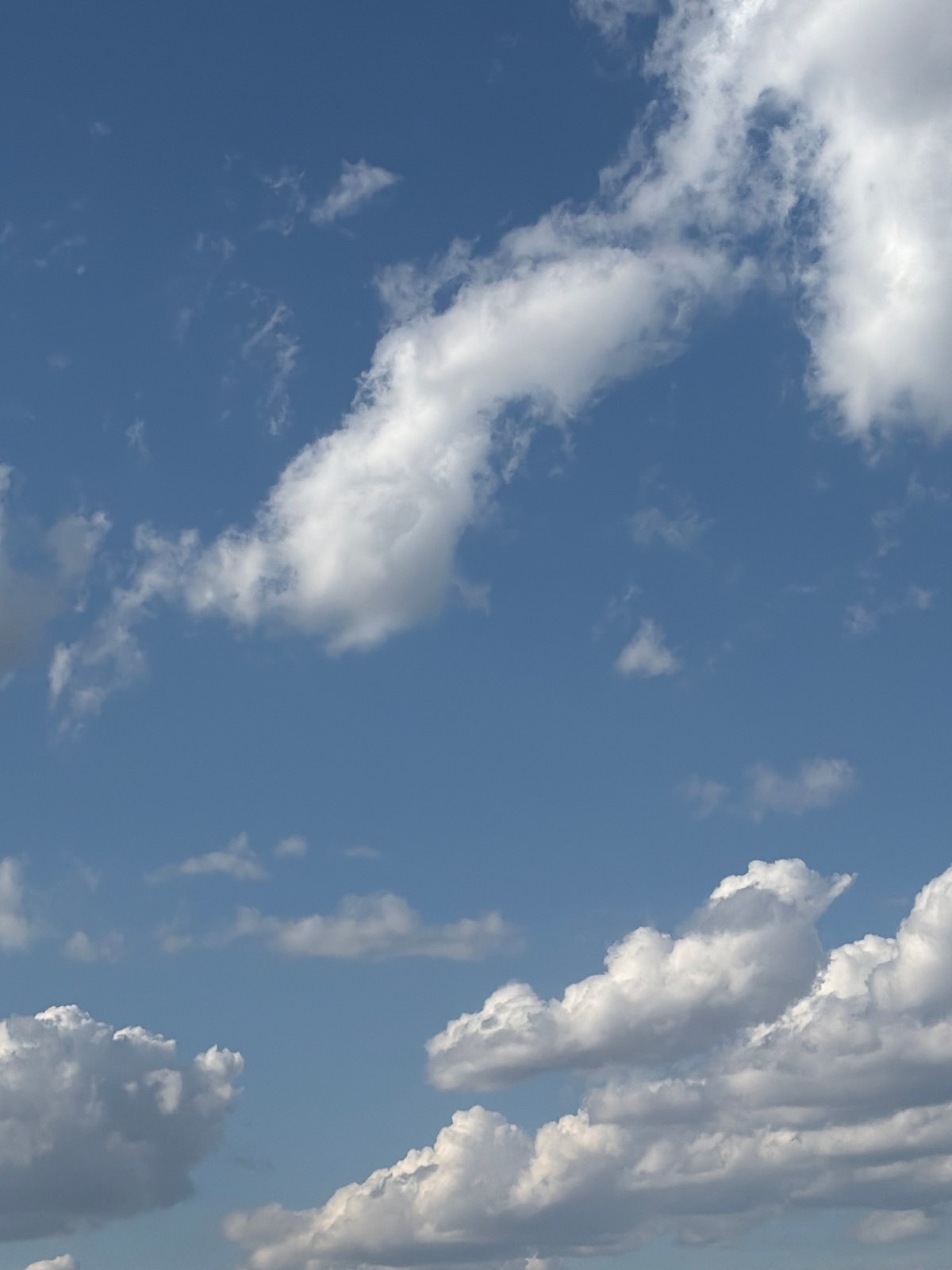 Red-white telecom tower spotted amid clouds in Krasnoyarsk
