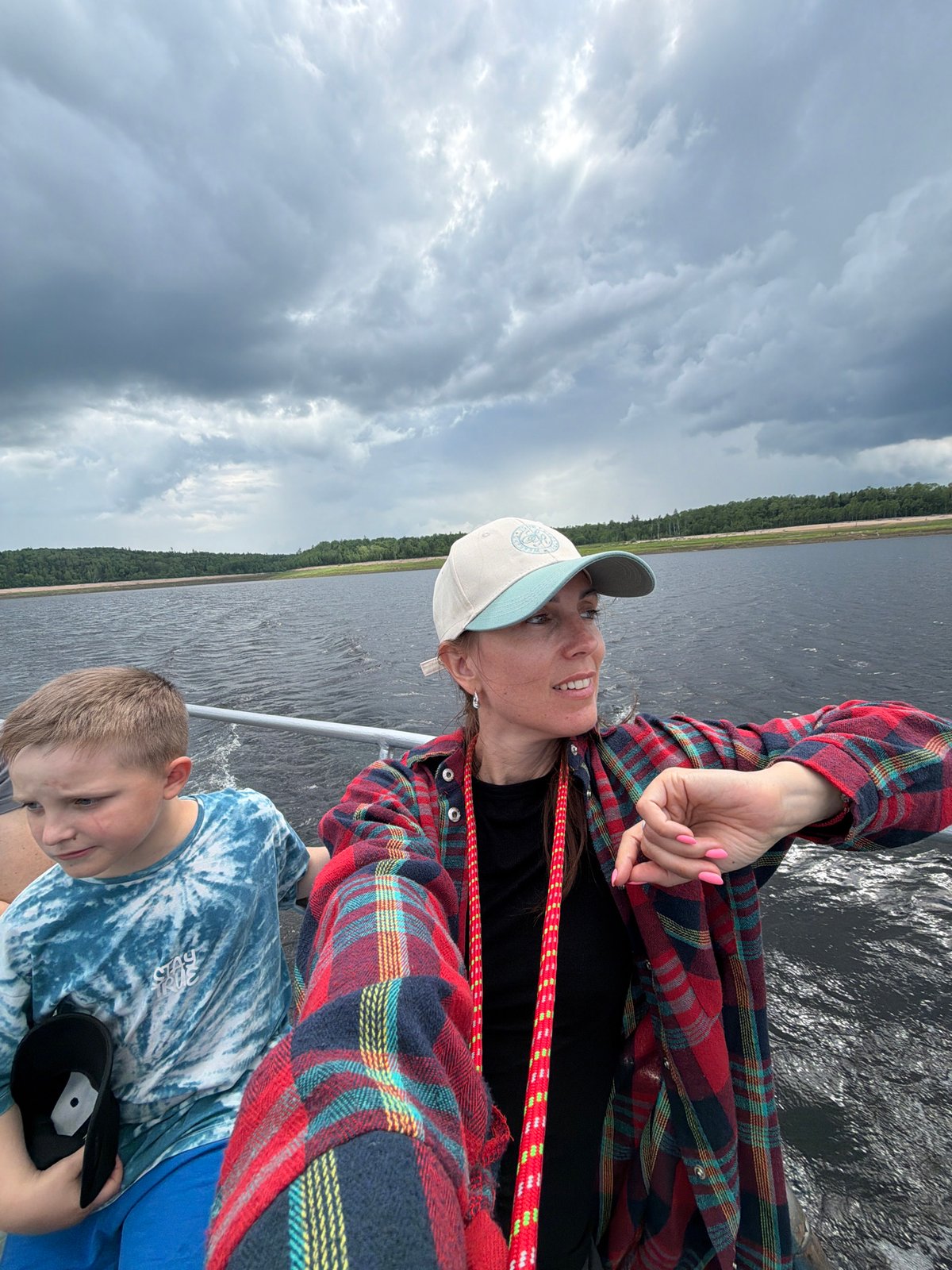 Boat ride across a Russian river or lake, midsummer