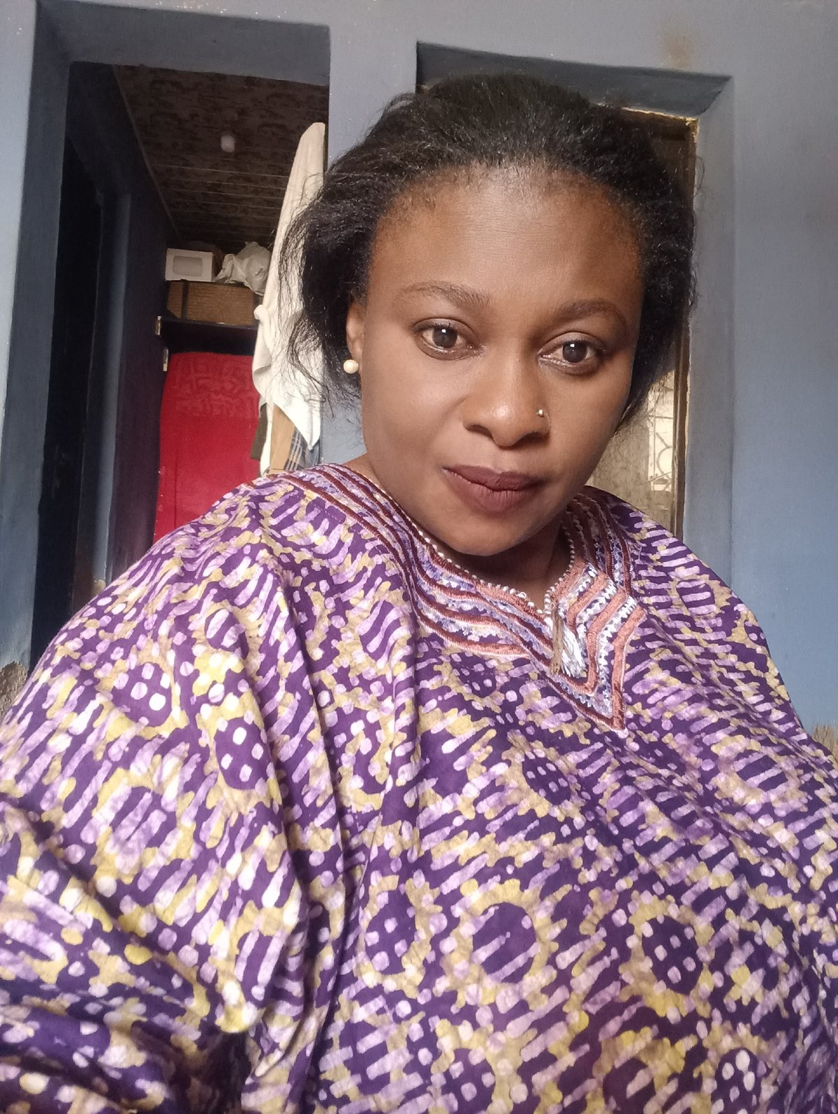 Woman photographed in kitchen setting in Jos, Nigeria