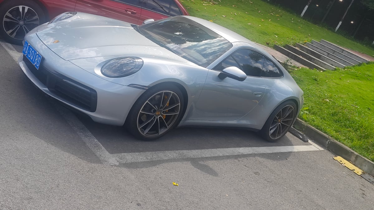 Silver Porsche spotted parked in Jiulongpo District on sunny morning
