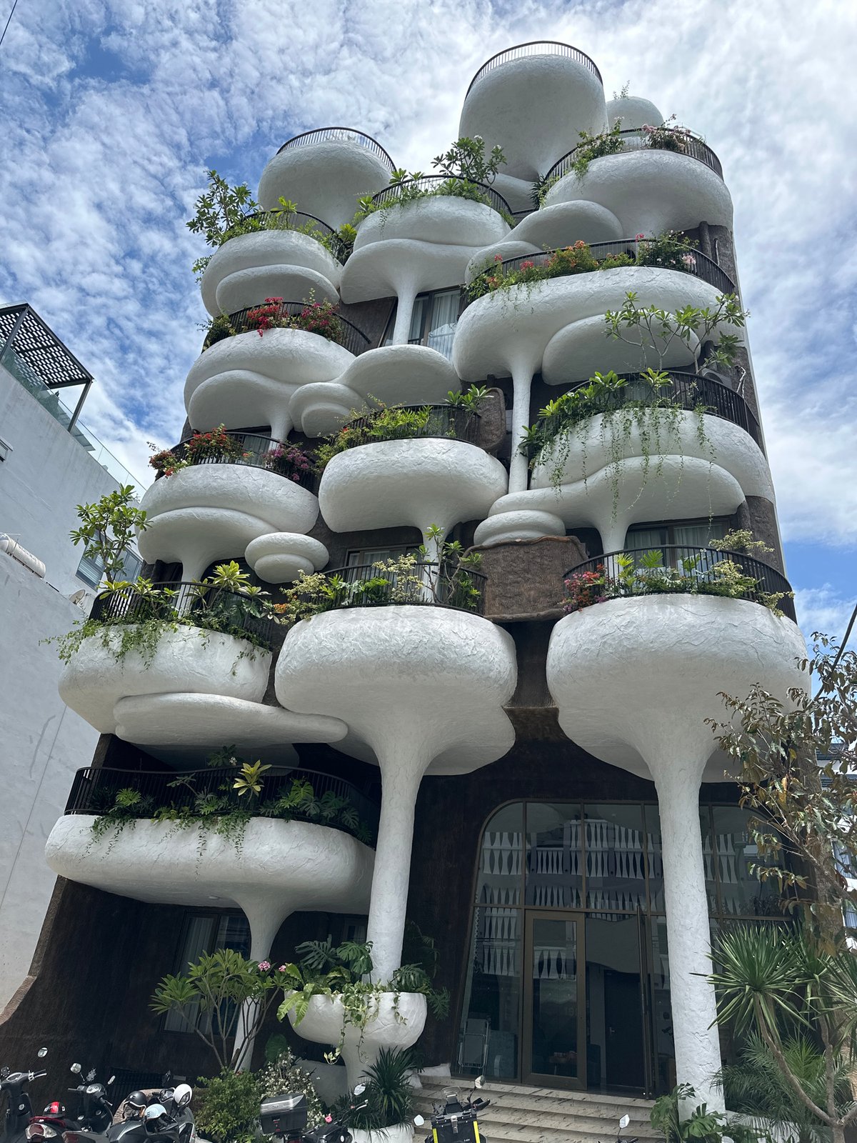 Da Nang's sculptural building with bulging balconies and trailing plants