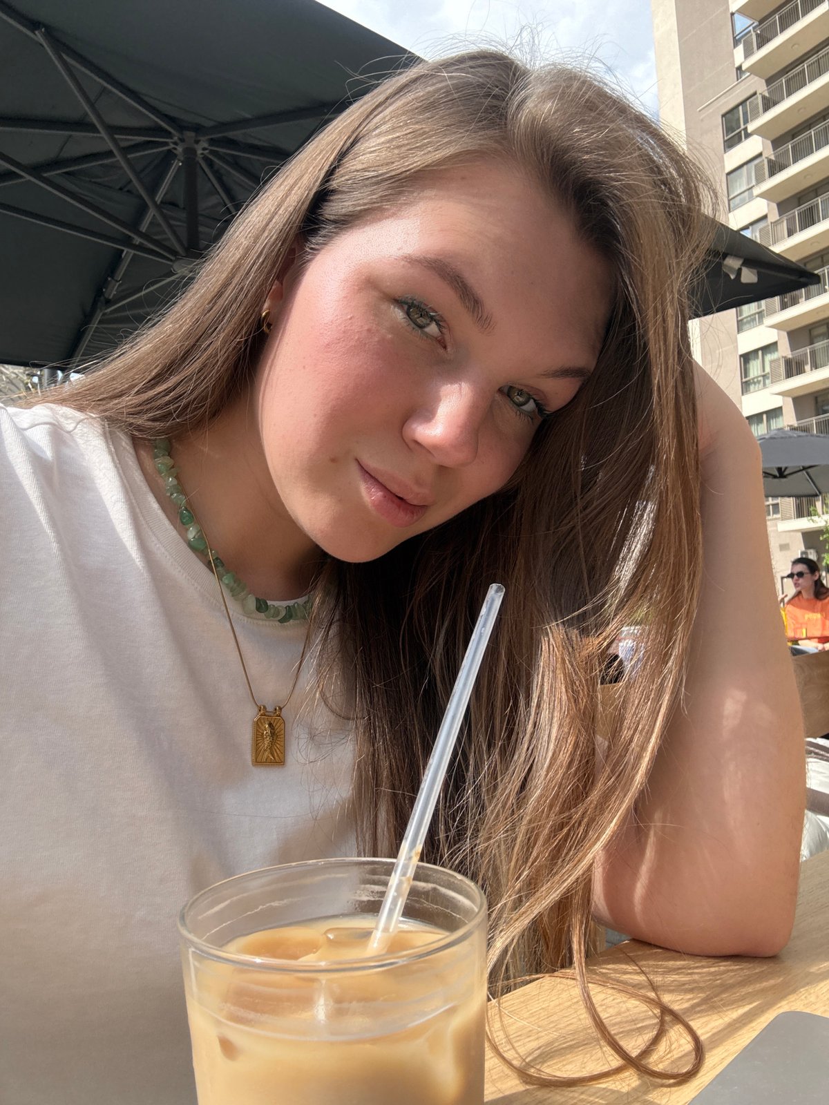 Woman enjoys sunny lunch at Belgrade cafe