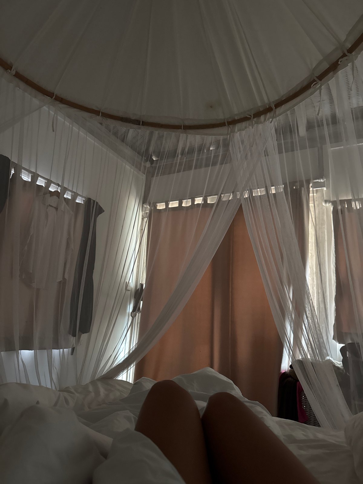 Bedroom interior with mosquito net documented in Indonesia