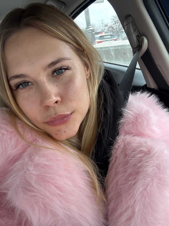 Portrait of blonde woman captured in vehicle, Moscow