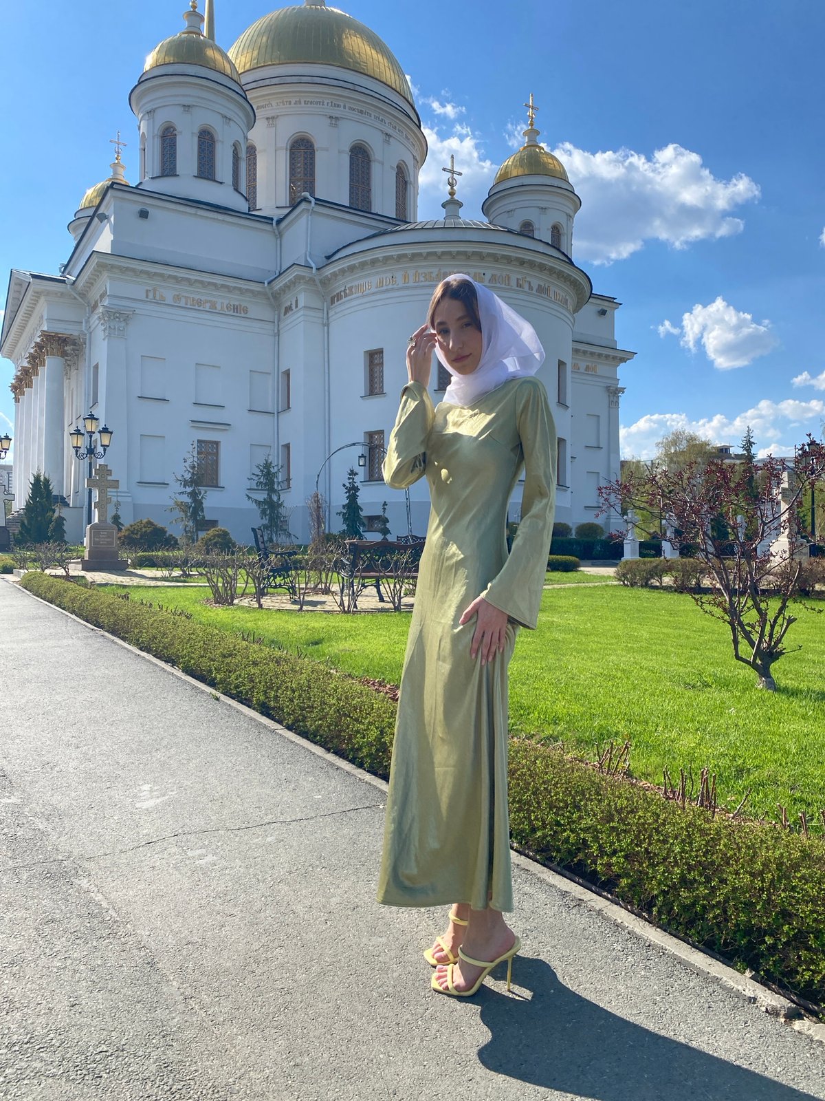 Woman photographs at Church on Blood in Yekaterinburg