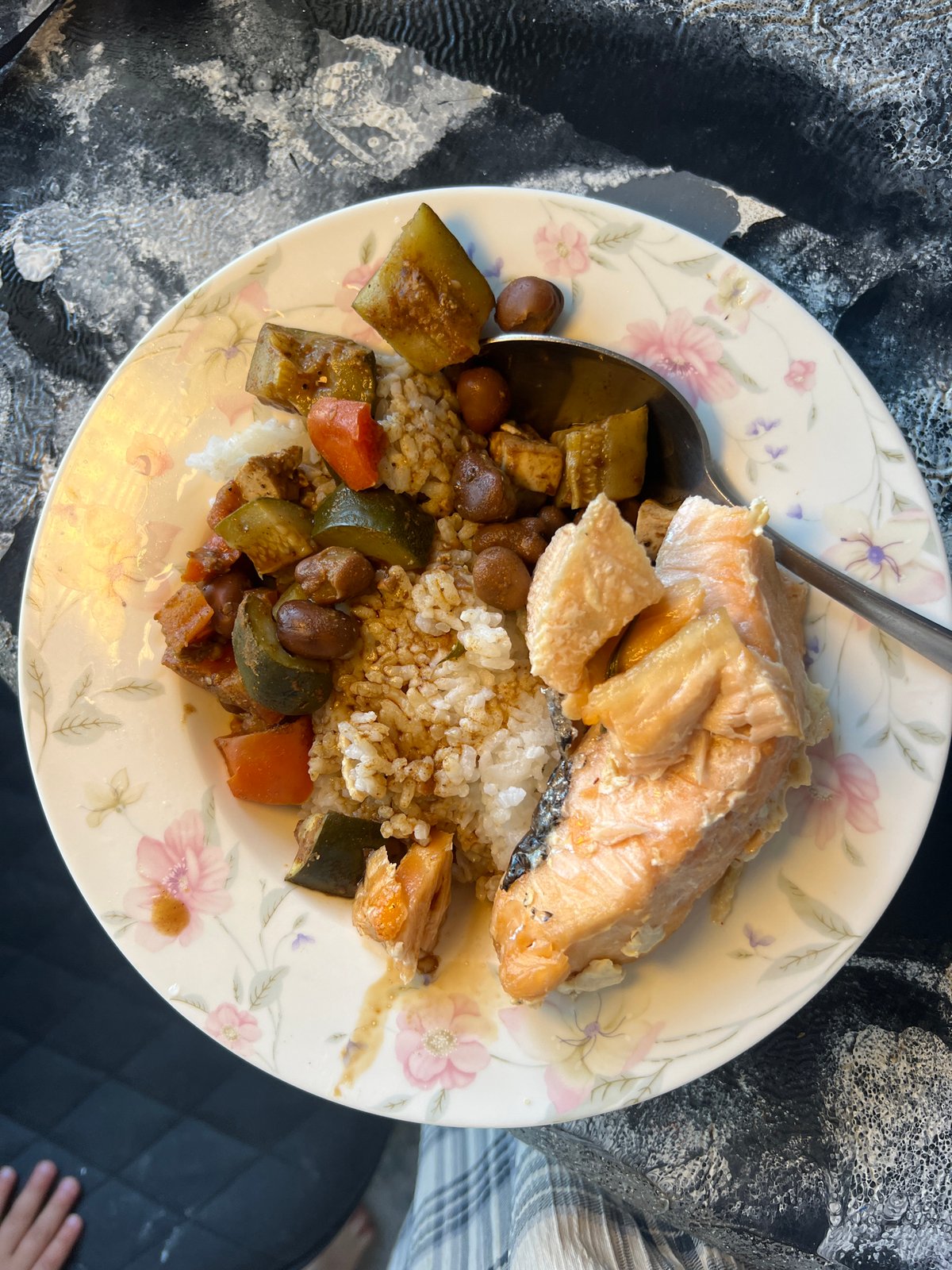 Salmon meal photographed on floral plate in Kiryat Bialik