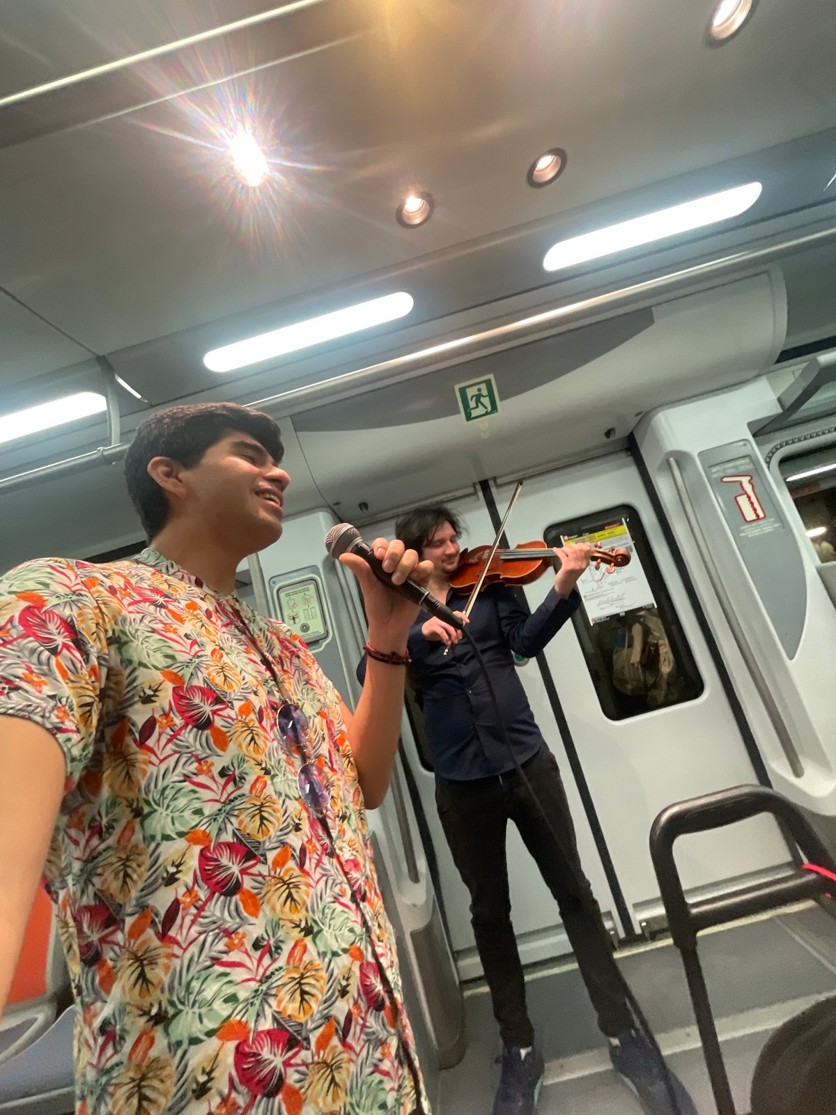 Street performers entertain passengers on Barcelona metro train
