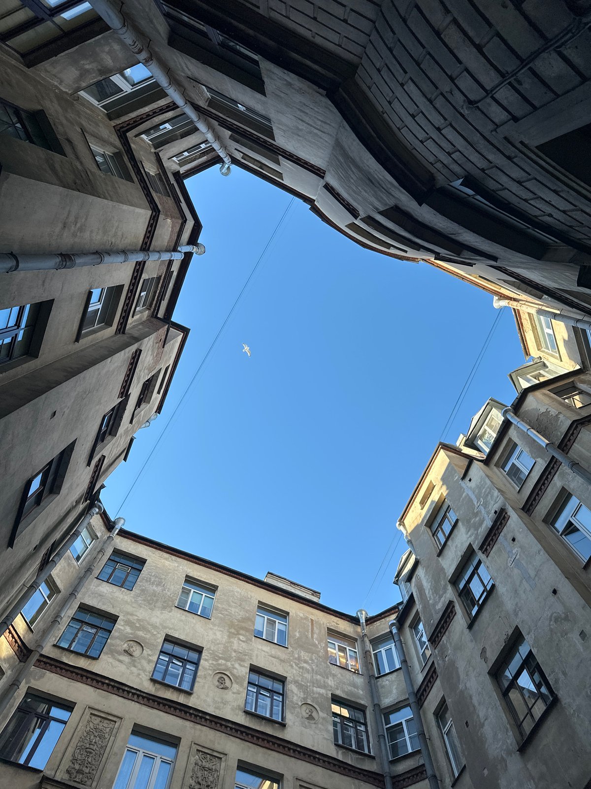 Urban architecture and cafe life documented in unnamed city