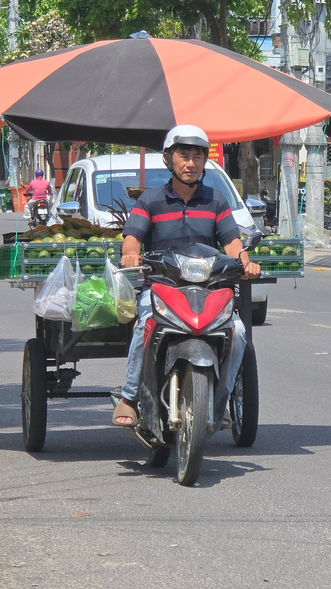 Morning motorcycle commute scenes captured across Nha Trang streets