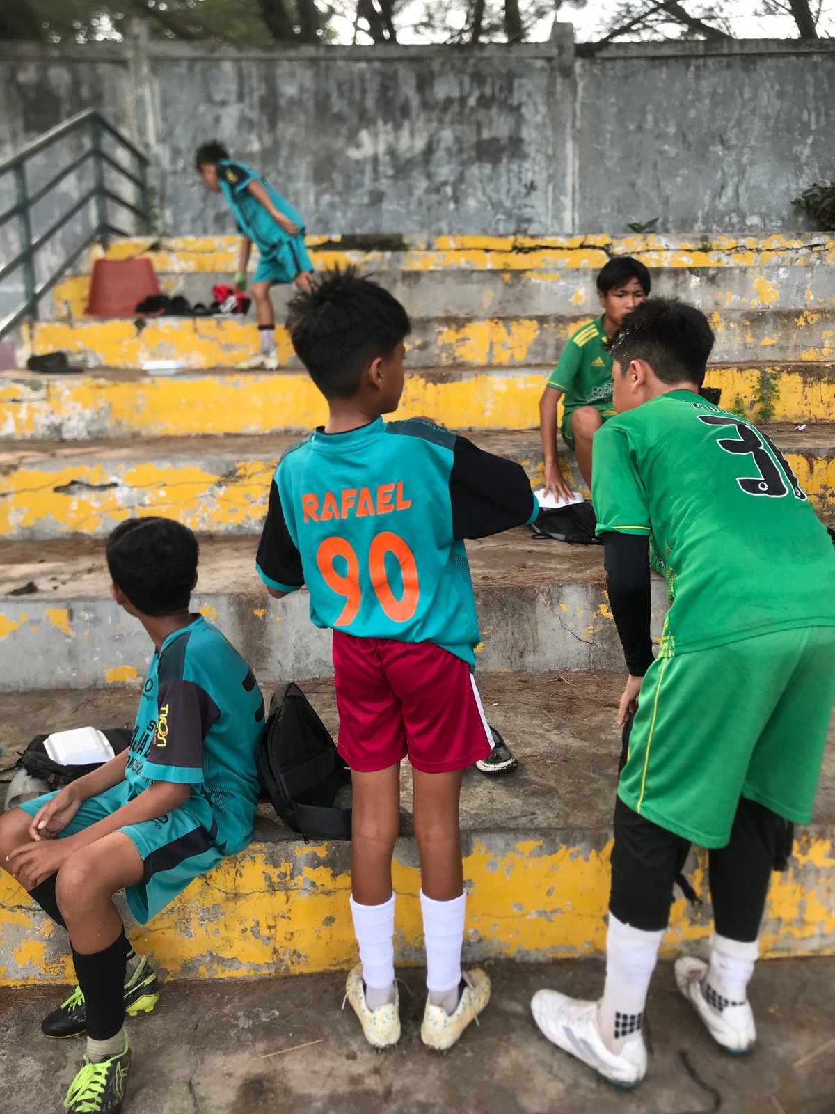 Soccer team warming up on steps in Lhokseumawe