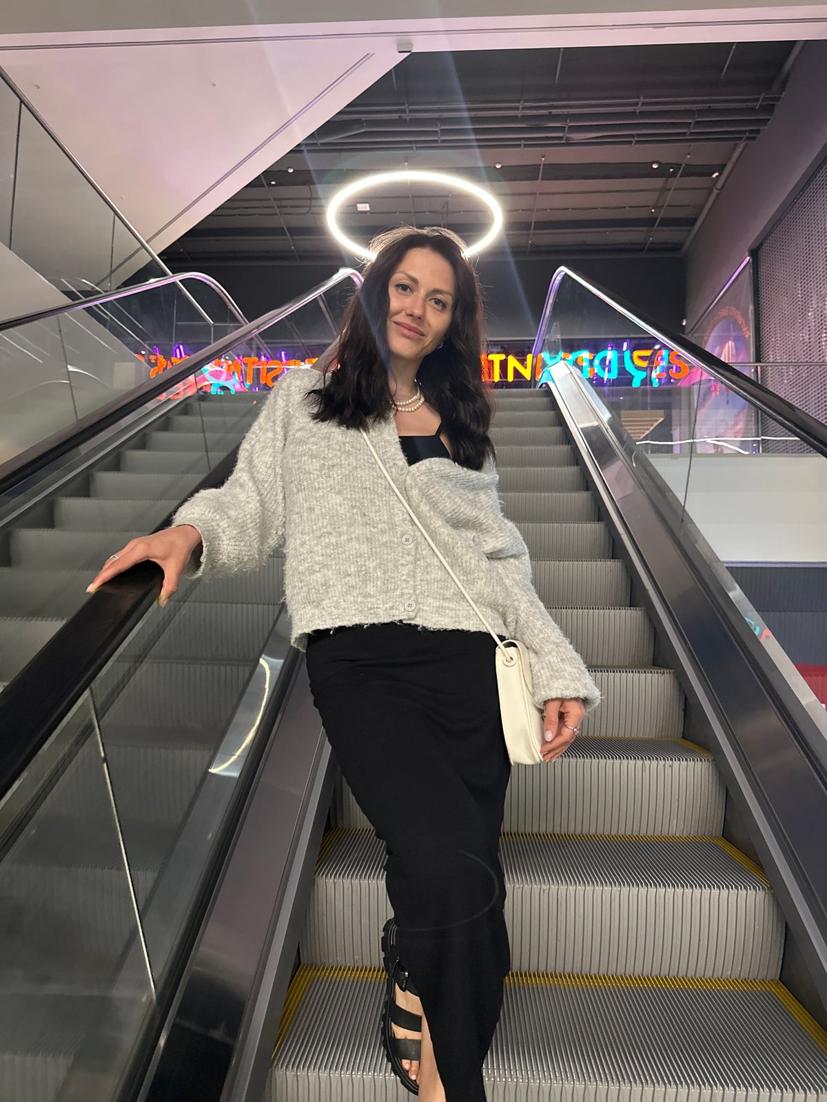 Woman observed using escalator in Murino building