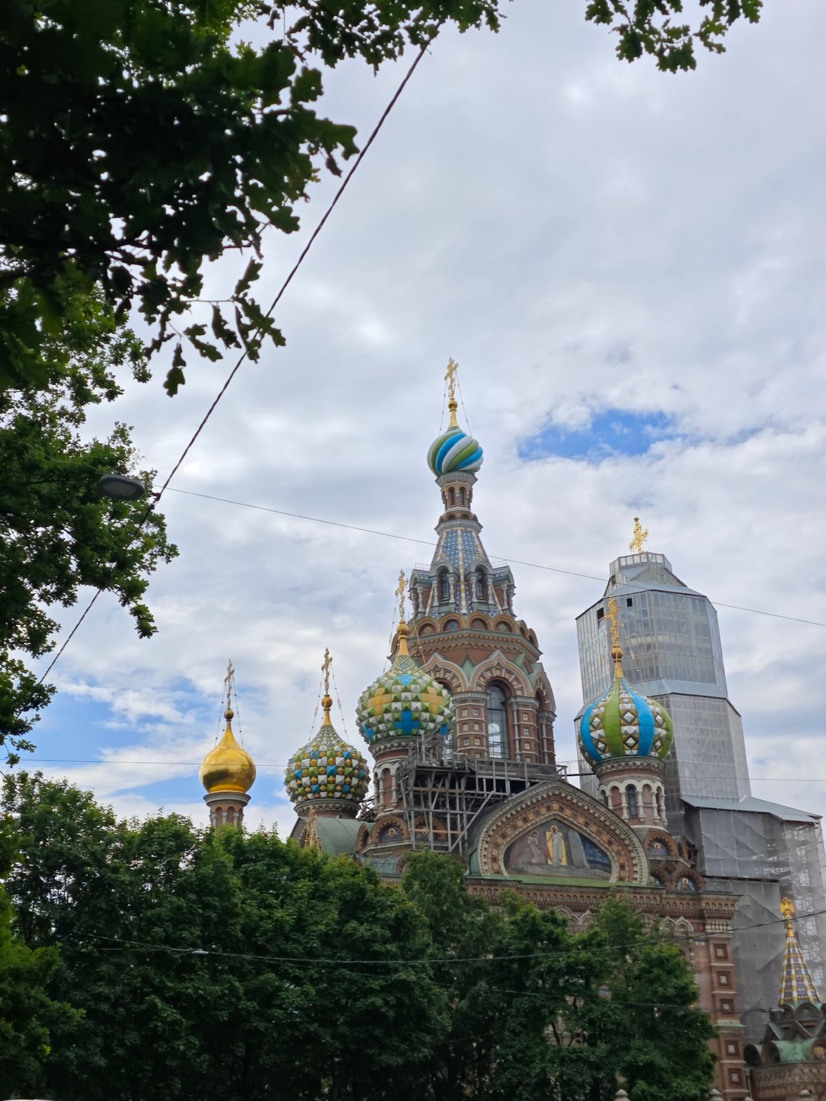 Tourist explores Saint Petersburg landmarks during overcast morning visit