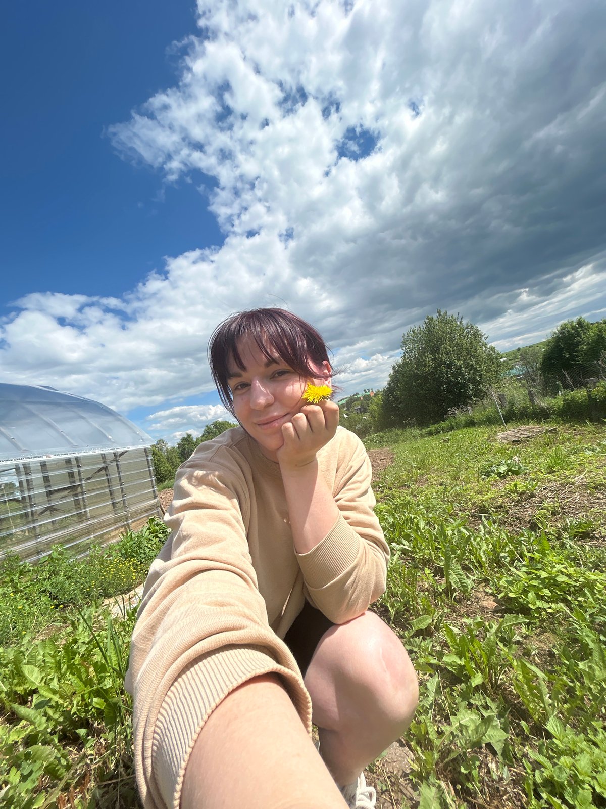 Woman documents morning garden activities in Фоки, Russia
