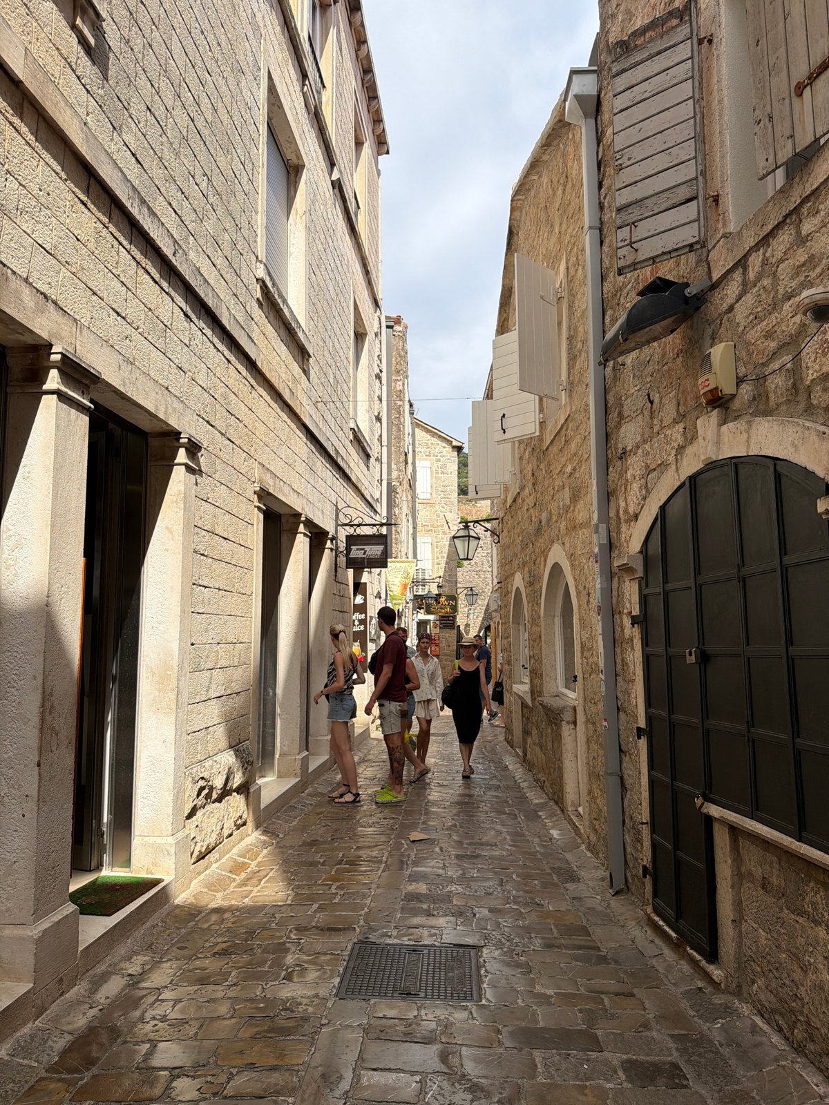 Summer morning in Budva's Old Town — streets, bars, and cafes