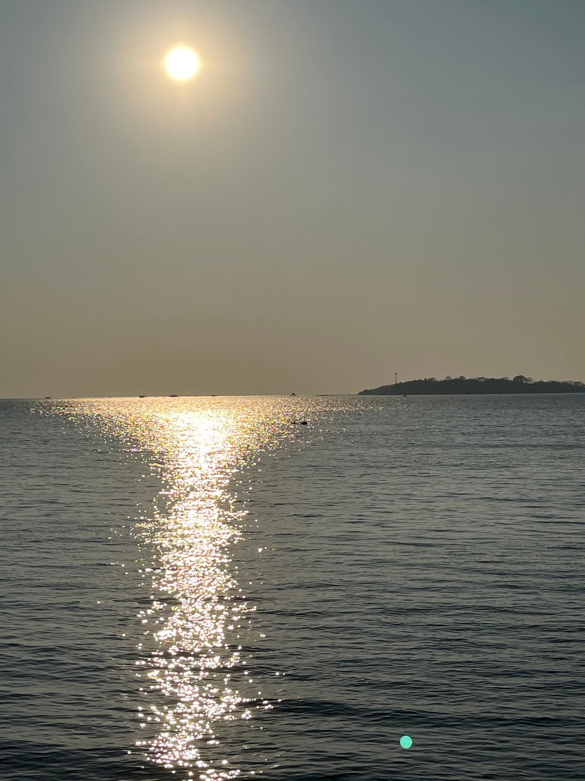 Golden sunset over calm coastal waters in Jepara, Indonesia