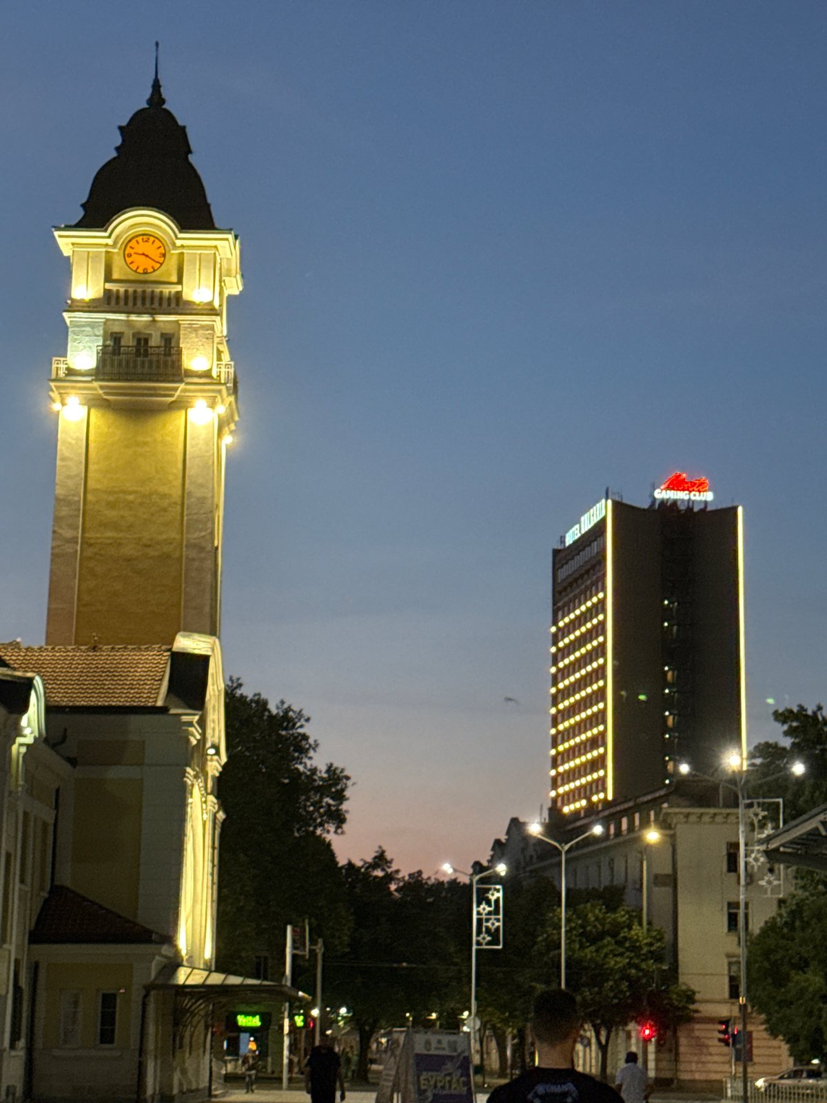 Historic Clock Tower illuminated at dusk in Burgas, Bulgaria