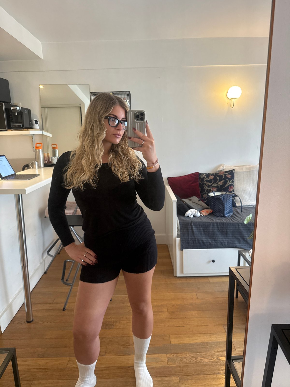 Woman takes selfies in Paris apartment