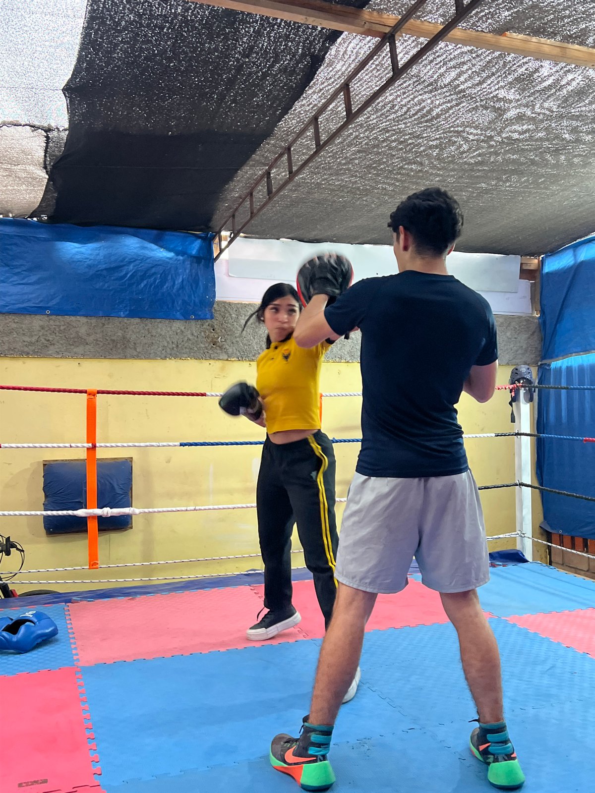 Boxing training and street repair work happening across Arica