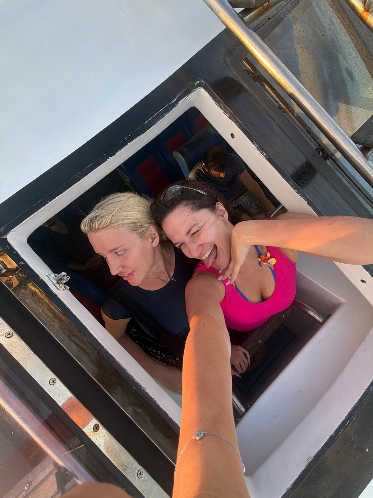 Tourists enjoy boat tour selfies off Denpasar coast