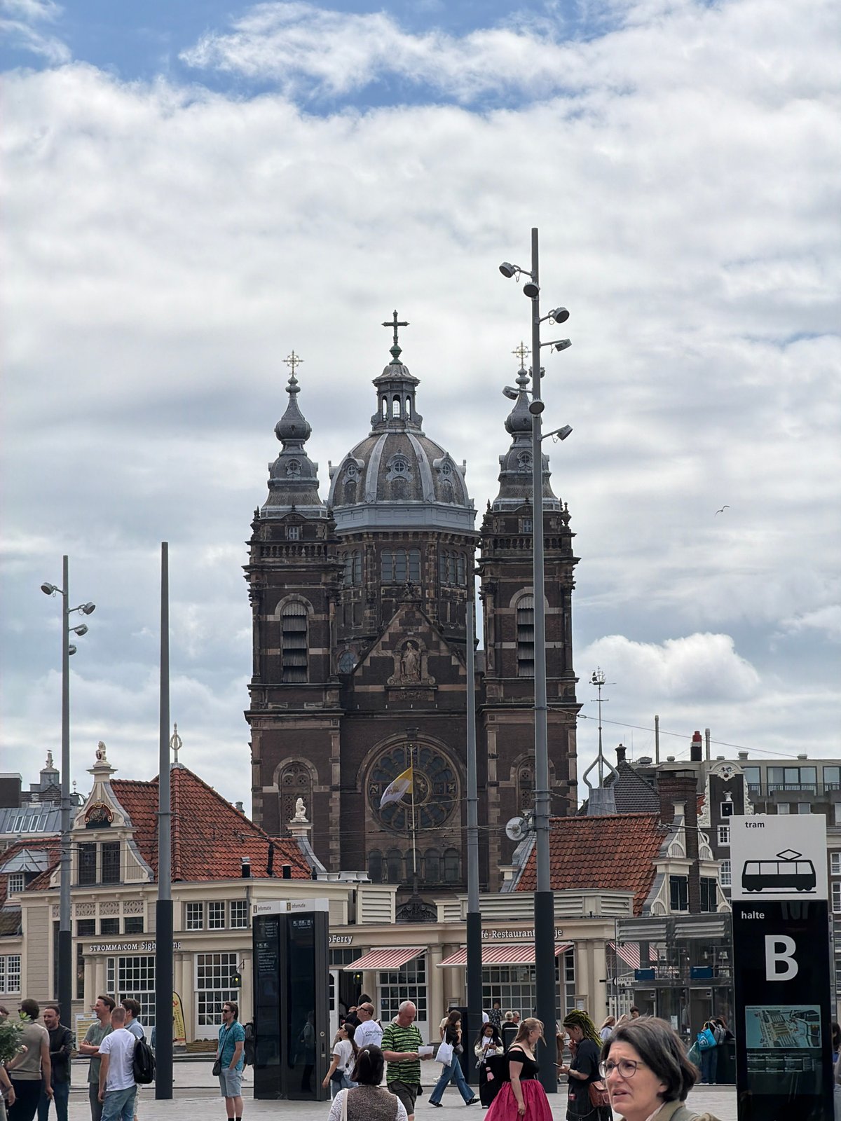 Amsterdam's central tourist corridor on a busy overcast morning