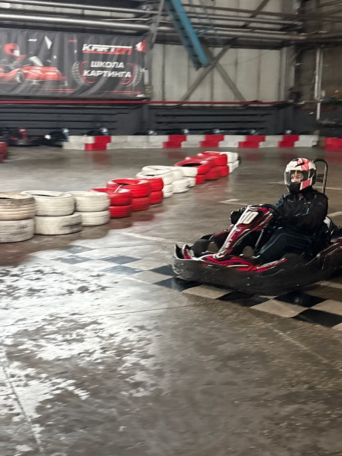 Indoor go-kart racing session captured at Perm facility