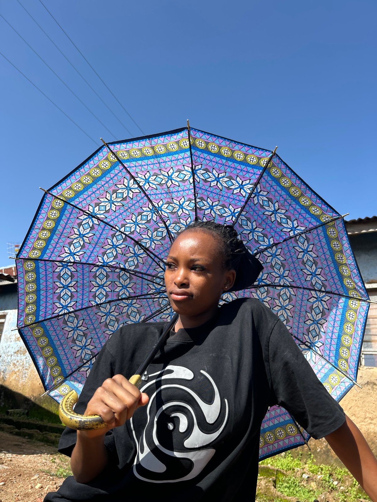 Street life in Jos: umbrellas, kids, and roadside snacks