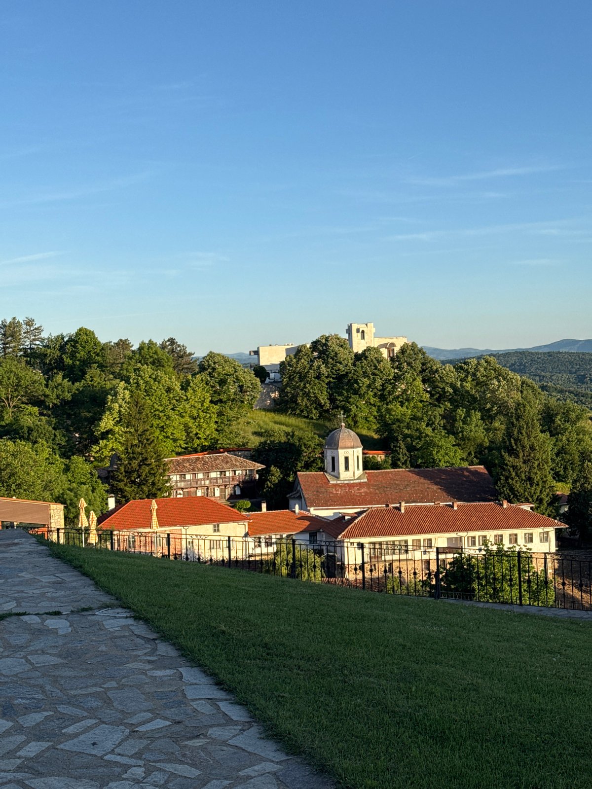 Young man plays, explores historic Bulgarian village during afternoon visit