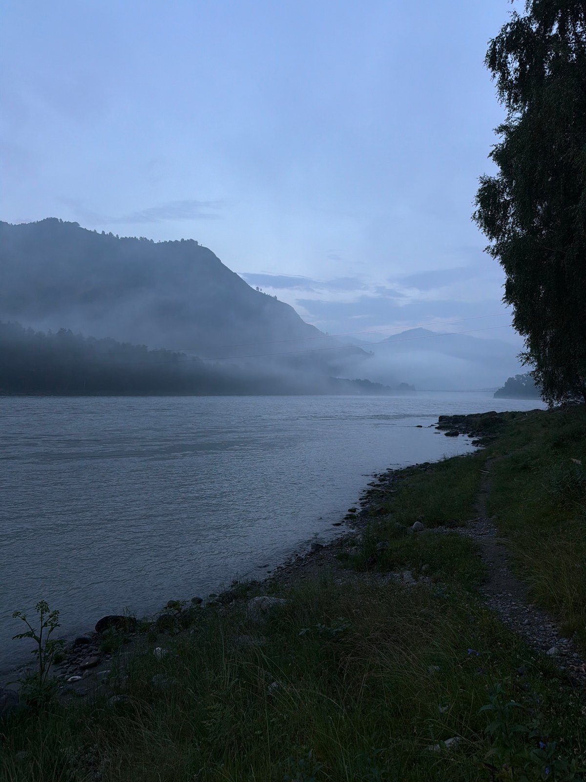Dusk along a quiet river valley in Anos, Russia