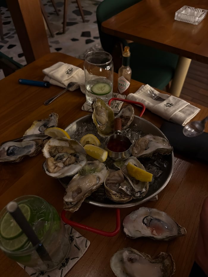 Diner enjoys fresh oysters at Canggu restaurant