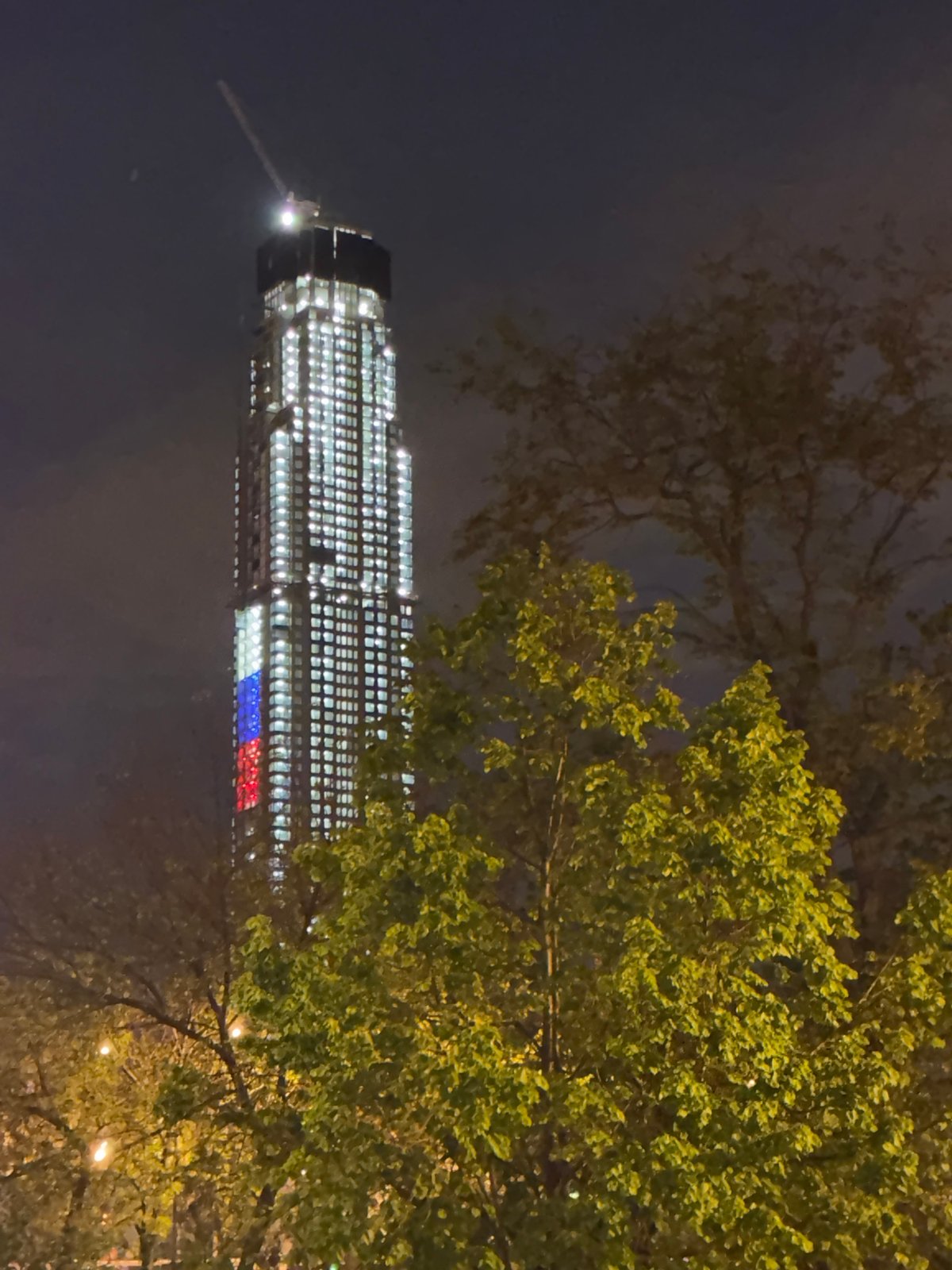 Moscow Evening: Skyscraper Lights, Indoor Meditation, Urban Greenery
