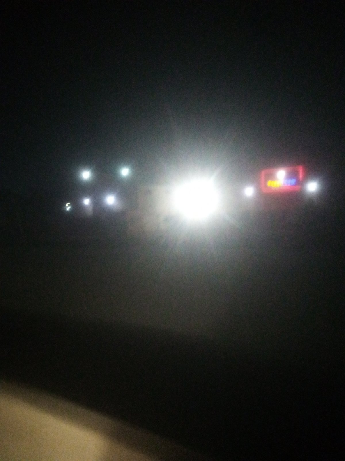 Festive gathering under string lights in rural Nigeria at night