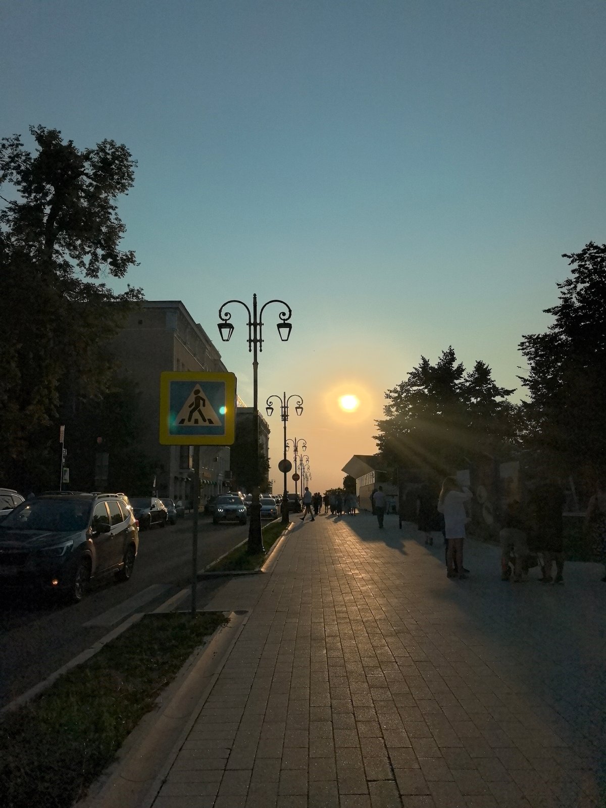 Summer evening around a red ice cream truck in Nizhny Novgorod