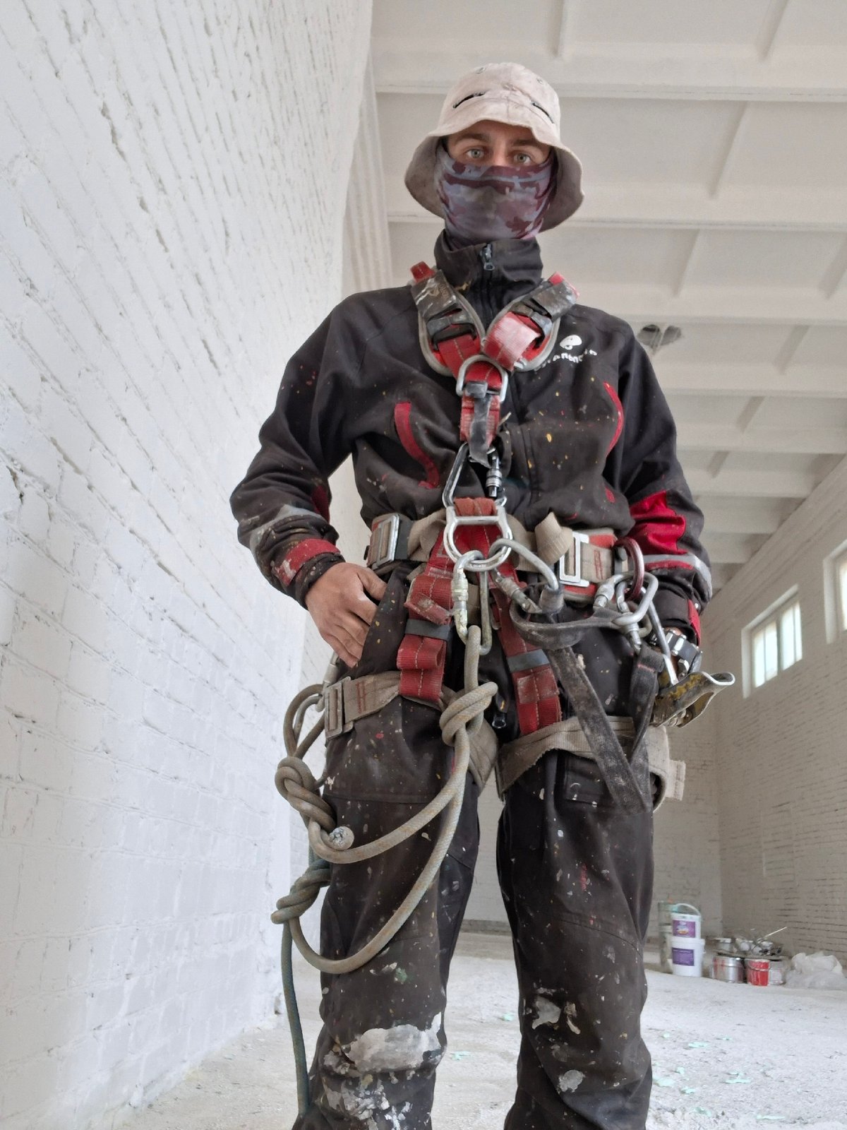 Construction worker and farm equipment documented at industrial facility