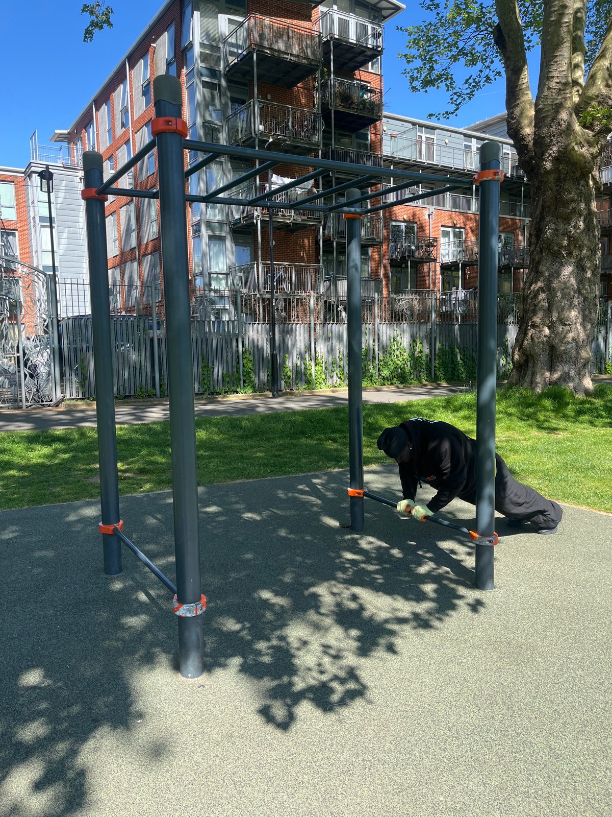 Man exercises at outdoor calisthenics park in London