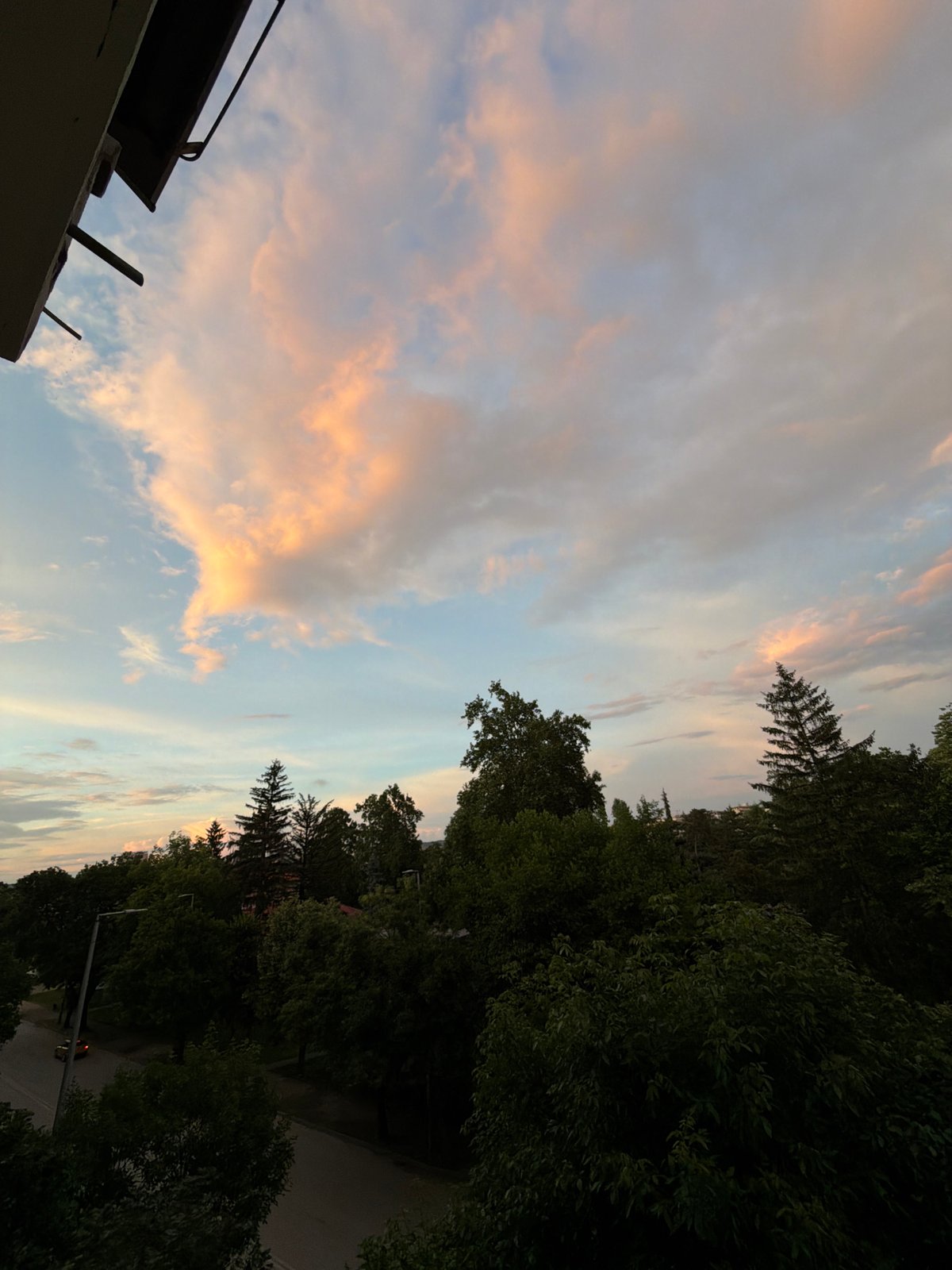 Twilight sky with rainbows observed from elevated position