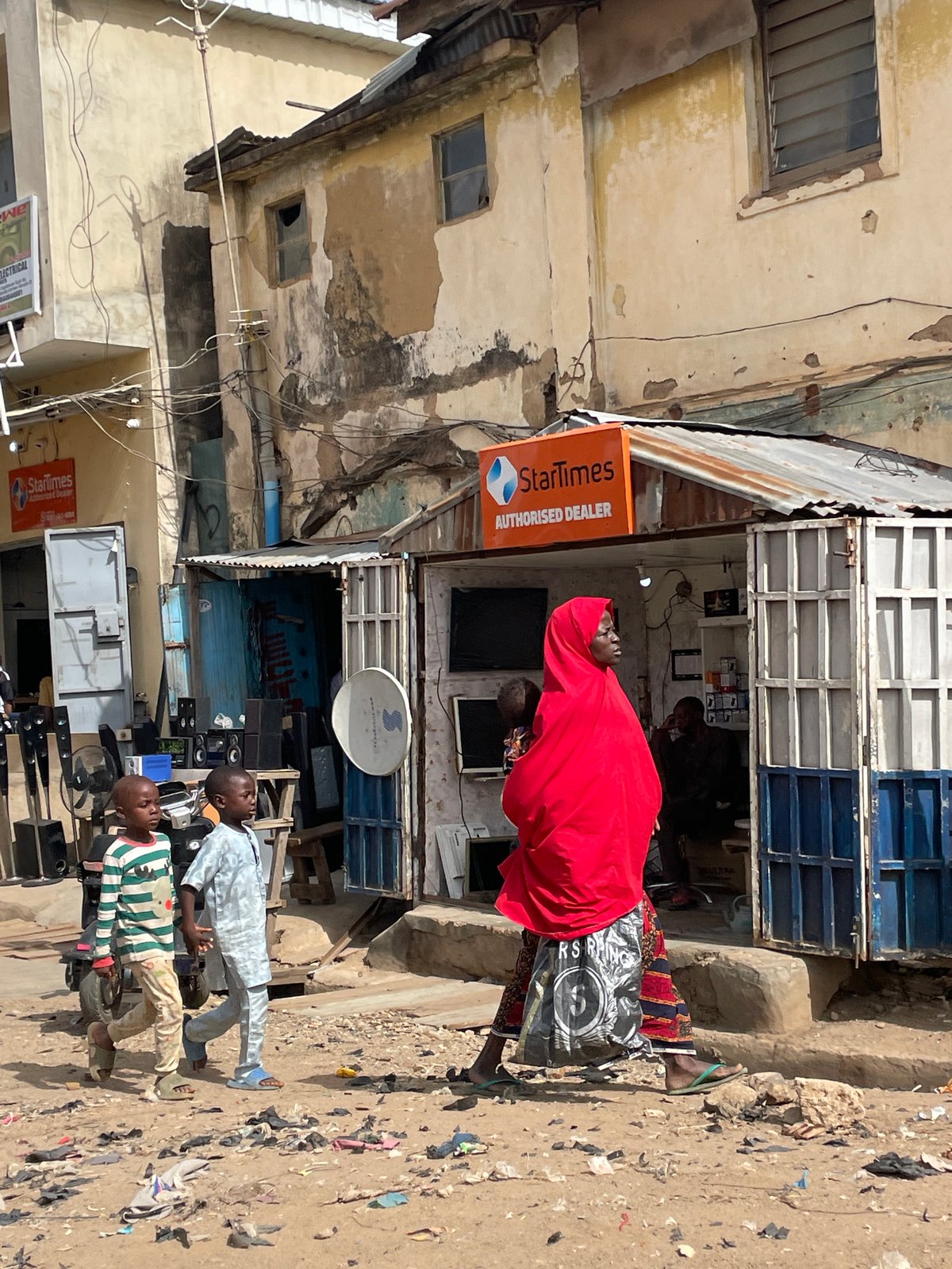 Everyday street life documented across Jos, Nigeria commercial district