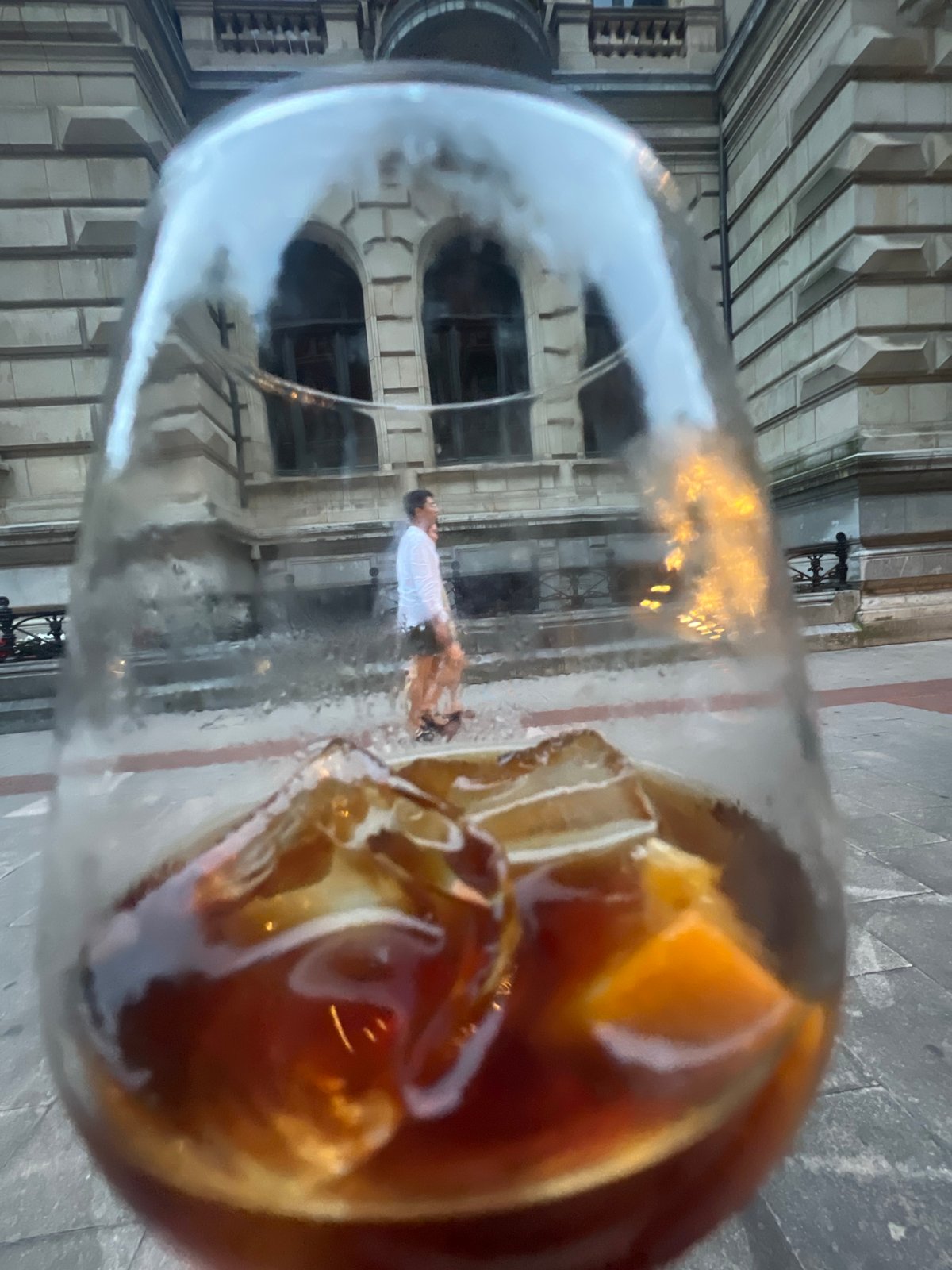 Bilbao evening: old stonework, glass towers, and drinks out