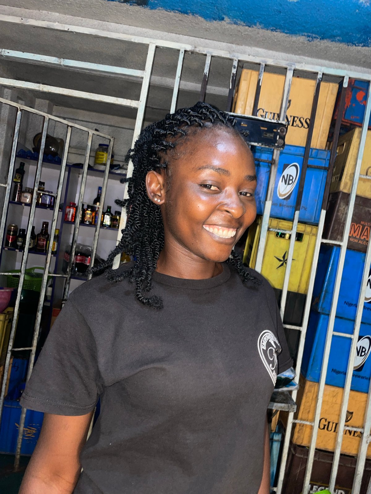 Young person photographed smiling at Jos beverage shop