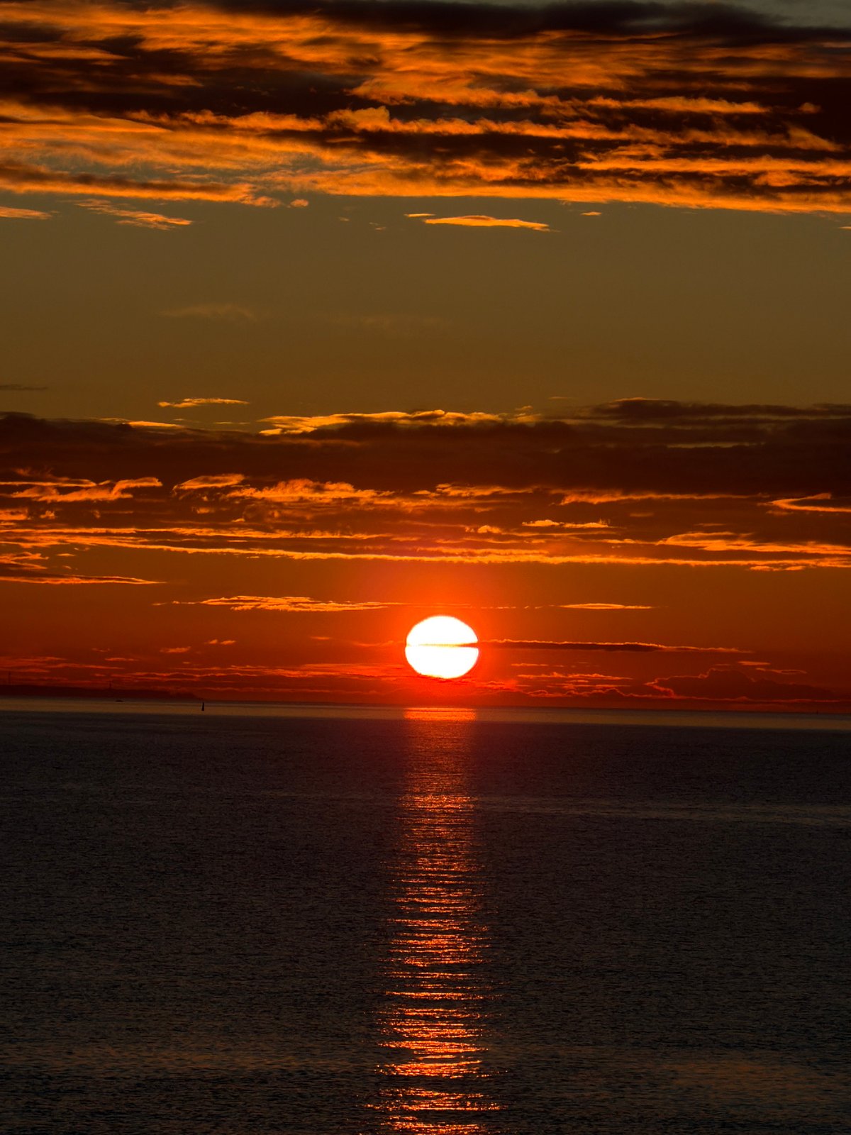 Sunset gathering at Tallinn waterfront with Baltic ferries