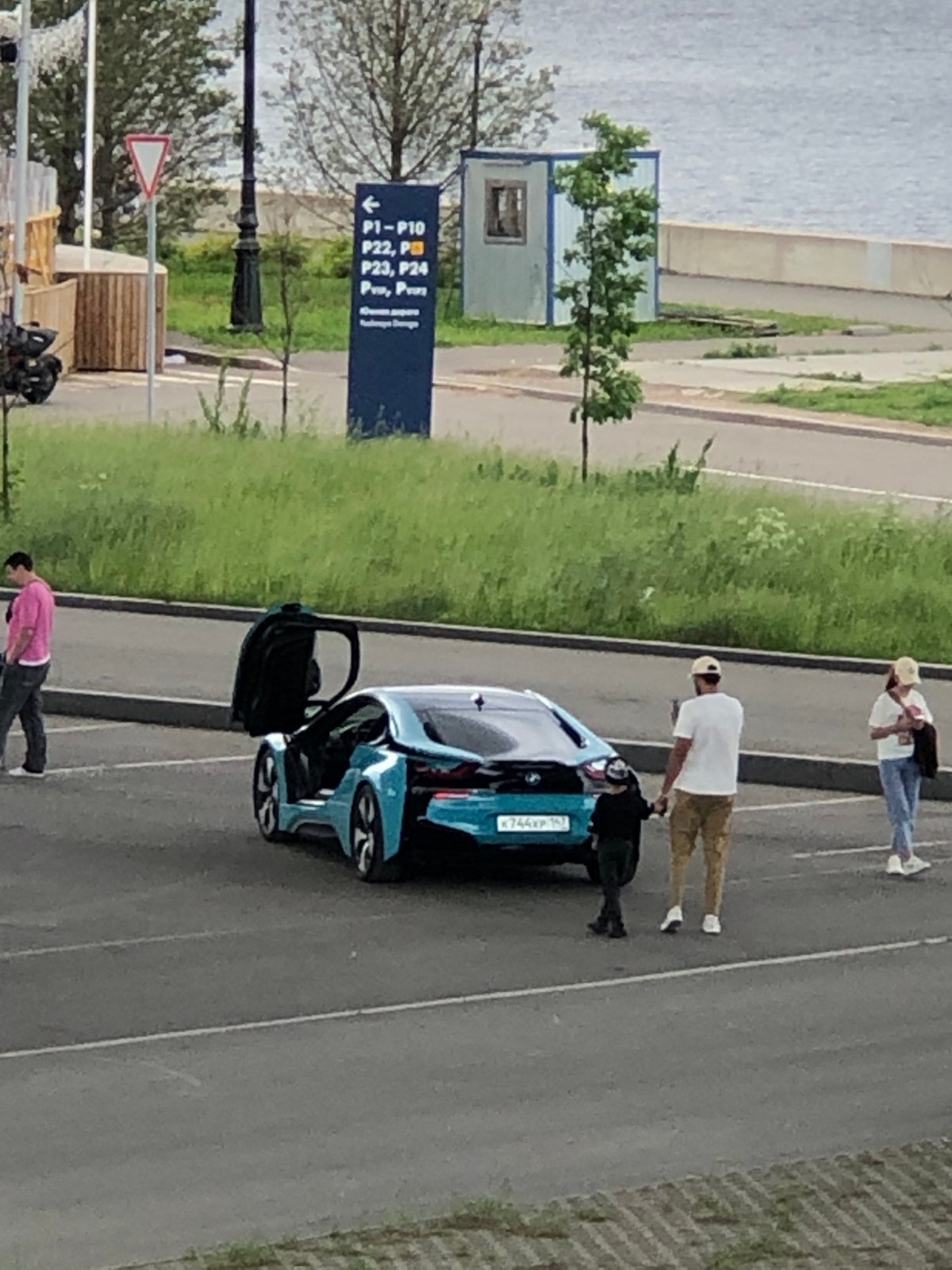 Mixed urban scenes across Russia featuring cars, waterfront views, street life